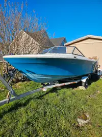 16 ft boat motor and trailer 