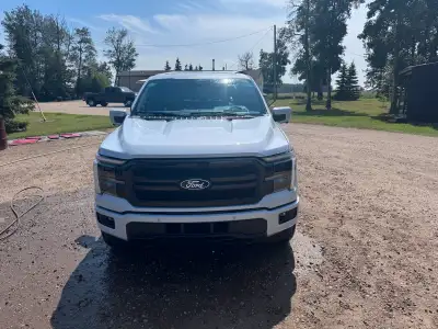 This 2025 Ford F150 Lariat is a stunning pickup truck with only 1162 kilometers on the odometer, off...