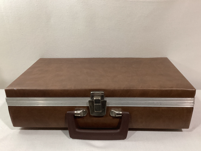 In preowned gently used condition. Holds up to 24 tapes. Padded faux exterior with plastic handle. C...