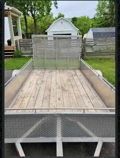 This is a 6x10 foot aluminum Bear trailer, complete with a ramp for easy loading and unloading; this...