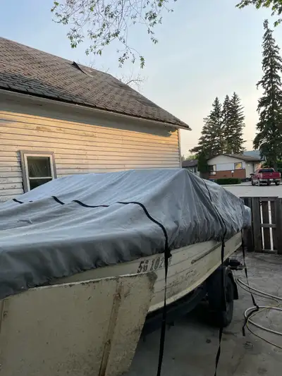 Springbok Aluminum boat with tilt trailer, 70 Hp with tilt can be heard running. Easy roll double wh...