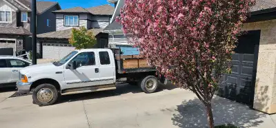 2004 F450 V10 Gasoline with an automatic transmission. Has a 10ft electric/hydraulic dump box/flat d...