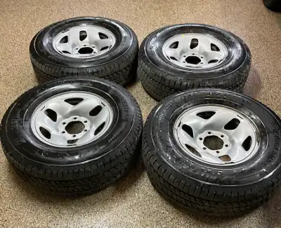 For sale, one set of four Bridgestone Blizzak LT winter tires mounted on Toyoya OEM steel rims, tire...