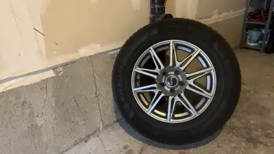 Selling a full set of 17” Fast aftermarket wheels wrapped in Michelin X-Ice Snow tires (235/65R17)....