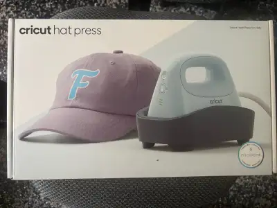 CRICUT HAT PRESS new in box 150.00. Curved heat plate, universal hat form, and Bluetooth connection