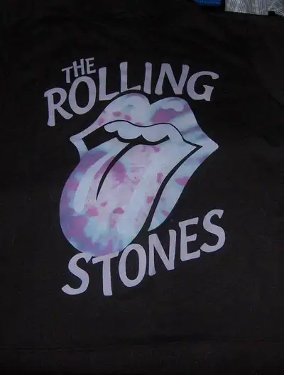 It's like new and a long sleeve shirt. Great for any Rolling Stones fan. It's either a medium or sma...