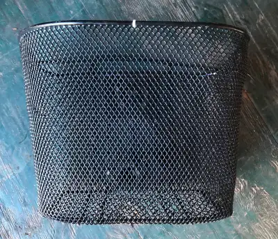 Bike basket that attaches to handlebars. Has quick release so you can carry it around also. Excellen...