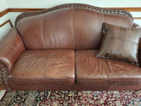 Leather couch with pillow 