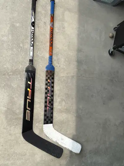 Two 23” True Goalie Sticks, View more