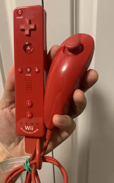Get ready to level up your gaming experience with this vibrant red Nintendo Wii Motion Plus Remote a...