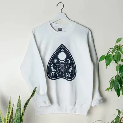 Brand new, never worn Ouija Board Planchette sweatshirt. Left over stock from a Halloween artisan ev...