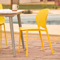 Two Yellow Article  Outdoor Dining Chairs