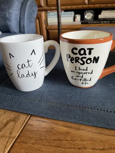 2 “Cat” mugs $6 each or both for $10, View more