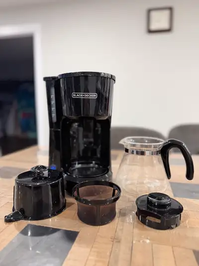 Start your day right with this used Black and Decker 5-cup coffee maker, perfect for brewing a quick...