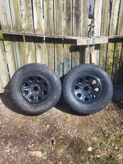 Pair of 17 inch Chevy GMC rims from around 2003 to 2024. 5.5 inch lug size. Tires are Bridgestone Du...