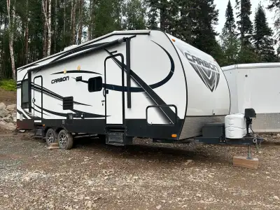 2014 Carbon 27 Toy Hauler. Seperate rear garage space with rubber flooring, fuel station, generator...