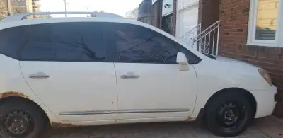 2012 KIA Rondo EX 2.4 L, 4 cylinder Front Wheel Drive White colour 235,000 km 5 Seater. Only issue i...