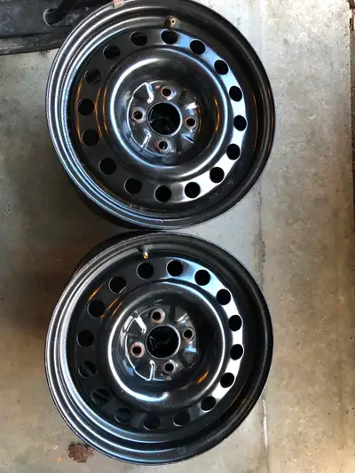 - 4 envy rims - used for one winter season - $10 each - 4 bolt - see photos for dimensions - text 51...