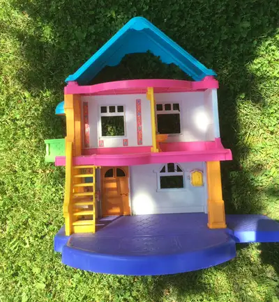 Open back dollhouse with dog, rabbit, baby, people, cars, table, chairs, and beds. - smoke free home...