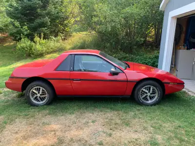Very clean show room condition Pontiac Fiero bought from original owner from out west. Never seen th...