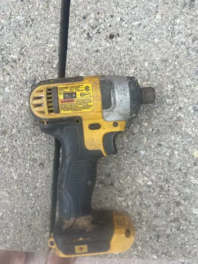 This is a used DeWalt 20V MAX impact driver, model number DCF885. It's in fair condition, showing si...