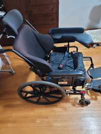 Wheelchair with wide seat and tilt.