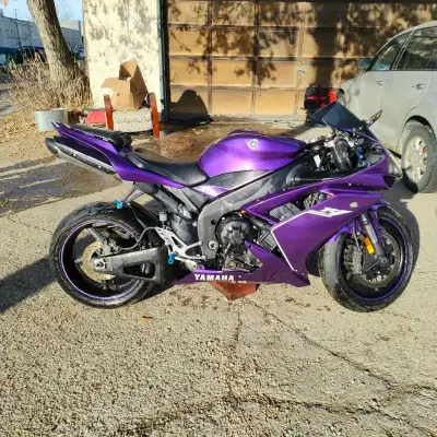 I'm selling my Yamaha R1 Raven edition, a real head-turner with its custom purple paint job and slee...