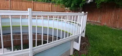 Safety fence for an above ground pool. 8 sections of white vinyl. It is currently attached but I wil...