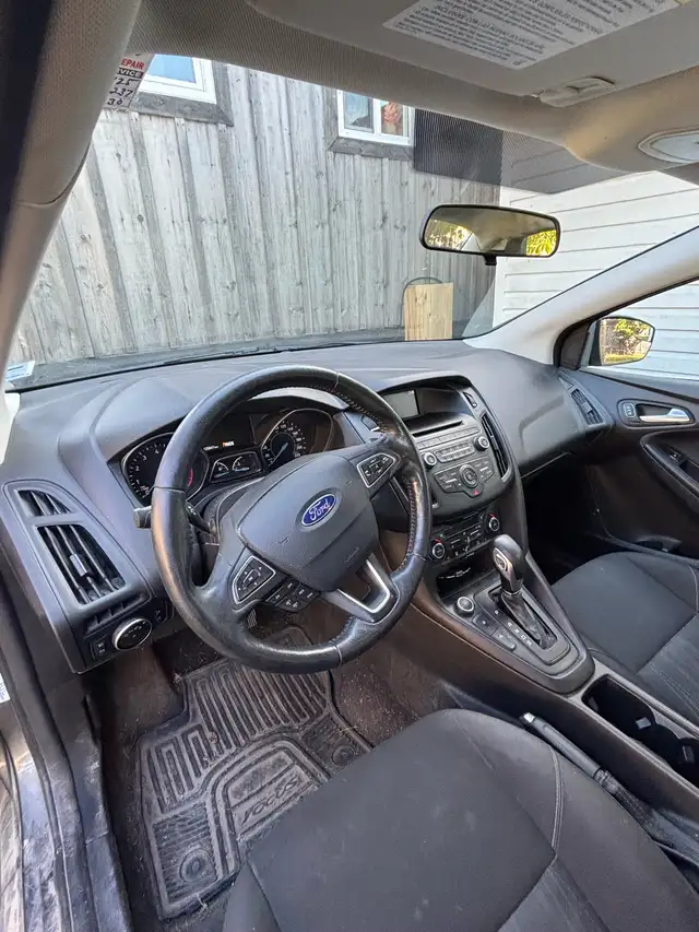 Ford Focus it has 4 studded winter tires on rims goes with it in Cars & Trucks in Cape Breton - Image 3
