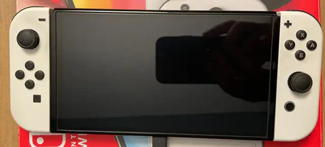 Nintendo Switch OLED with Zelda case + 2 games64601013407361121