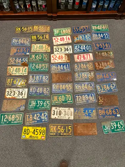 These are vintage Alberta licence plates ranging mostly from the 1950s–1970s, including farm plates,...