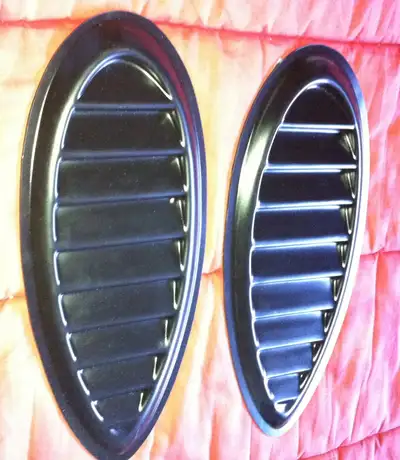 These are two ABS Escort Cosworth style stick on hood vents by RGM. Model AC11. These could be modif...