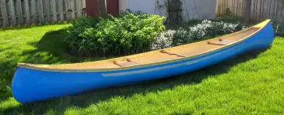 14 Ft Fiberglass Kawartha Canoe. Good shape with no leaks. Includes paddles.
