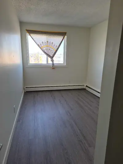 Basic Room 10×12 includes utilities and wifi 3rd floor Apartment Suite...month to month This is only...