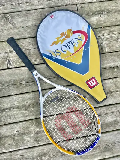 Up for grabs is a Wilson US Open USTA Edition tennis racquet, perfect for players seeking a blend of...