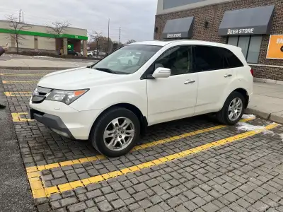 2009 Acura MDX Tech Package Beige leather interior 3 row seating Heated seats in front and rear Back...