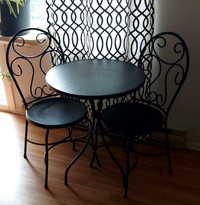 Black metal patio table and 2 chairs.