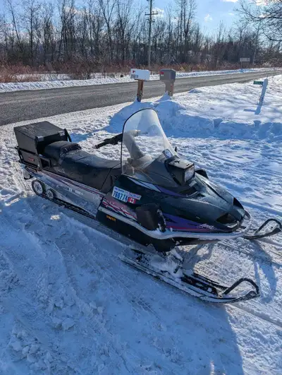 1995 Yamaha Enticer 2. 410cc long track. Runs well. Could use carb cleaning to help idle better. Ele...