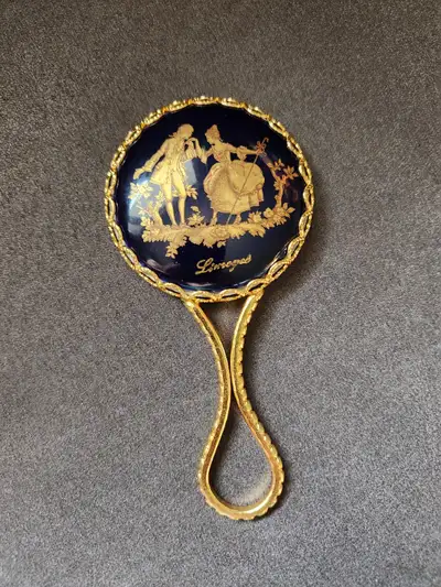 VINTAGE hand mirror for sale. LIMOGES FRANCE. Circa 1960s-1970s. Stamped. This miniature gold hand m...