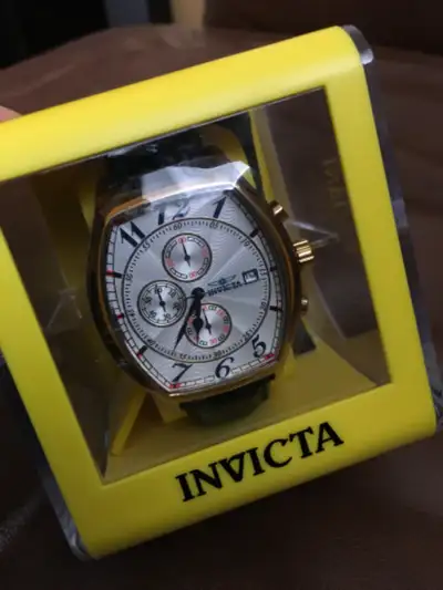 Invicta 18k gold plated men’s large chronograph watch new in box. Reduced price from $160 to $120
