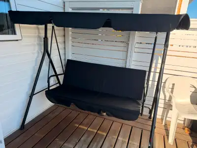 In a new condition 3 seater swing, located in Winkler