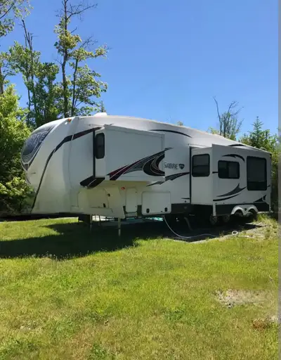 2012 Forrest River sabre 5th wheel. Great for families, has bunkhouse with two beds, and two bathroo...