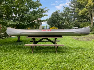 A beautiful 15 ft MichiCraft aluminum canoe, model DE-15. 650 lb capacity, great condition, no damag...