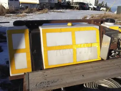 Pre-wet tank and pump for dispensing calcium chloride on a sanding truck. Bracket designed to hang f...