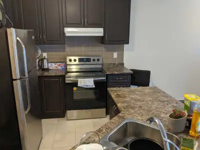 Bright, above ground basement apartment with private entrance featuring large windows and wood floor...