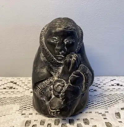 THE WOLF SCULPTURES Figurine Inuit Hunter Holding Harvested Seal, View more