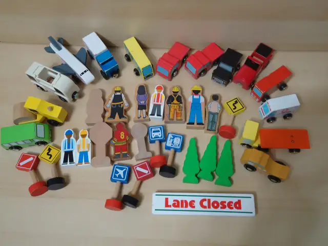 Lot of wooden vehicles street signs people for pretend play