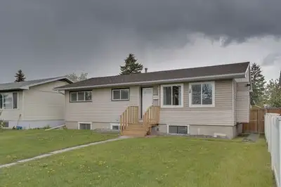 A detached house three bedrooms up and legal two bedrooms down. 15 minutes to downtown Calgary New f...