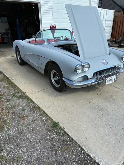 1960 Corvette in grey primer/sealer 350 cu.in. with dual four barrel carbs. and aluminum intake Munc...