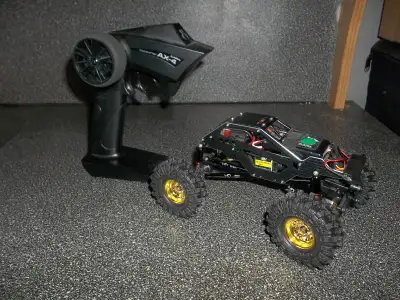 axial 1/24 scx24 rc rock crawler, basically new never been outside or in the dirt, upgraded parts ar...